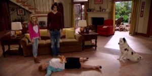 Avery, Tyler, and Stan the Dog (Stephen Full) stand over an unconscious Grandma James (Stephanie Faracy) in "Dog with a Blog" (2013) - source: Disney Channel
