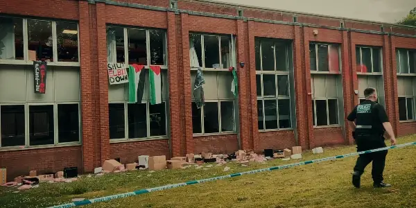 Palestine flags hang from Grid Systems factory